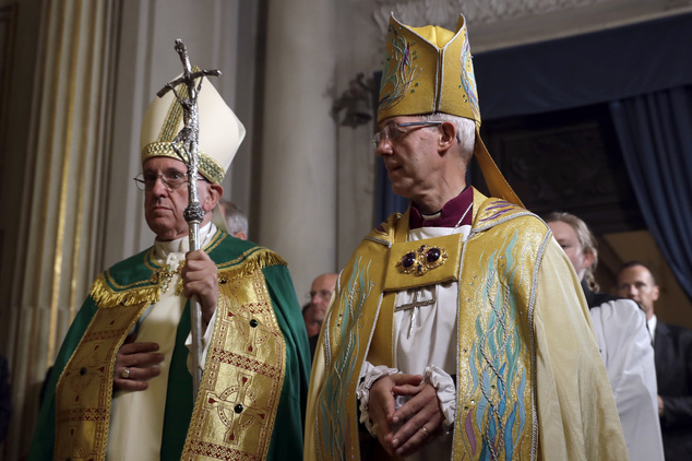 Pope Francis, left, and the Archbishop of Canterbury, Justin Welby, arrive for vespers prayers in the church of San Gregorio al Celio, in Rome, Wednesday, Oct. 5, 2016. (AP Photo/Gregorio Borgia)